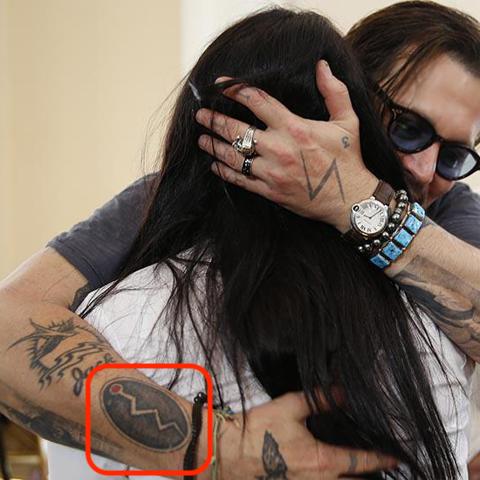 Johnny Depp Snake Tattoo