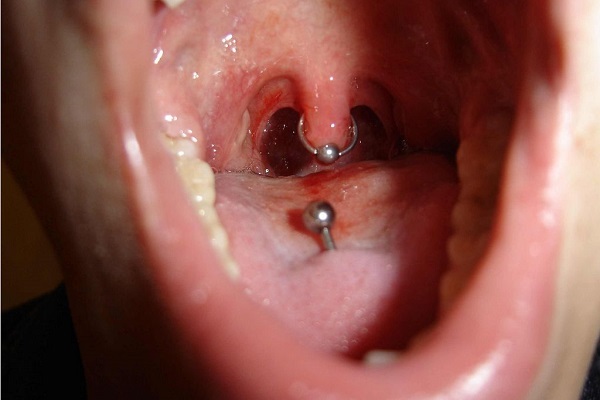 Uvula piercing and tongue piercings
