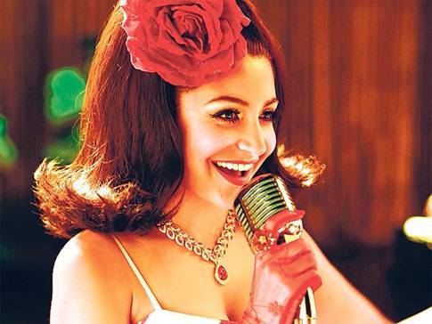 Anushka Sharma Hairstyles - Vintage inspired hair accessorized with flowers