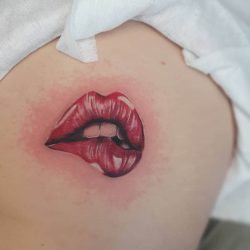 24 sexy butt tattoo - cute sexy lip bite tattoo
