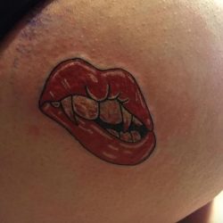 24 sexy butt tattoo - devil lip bite tattoo